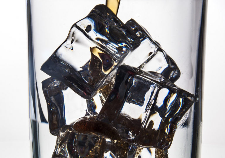 cola-pouring-glass-ice-27694571920